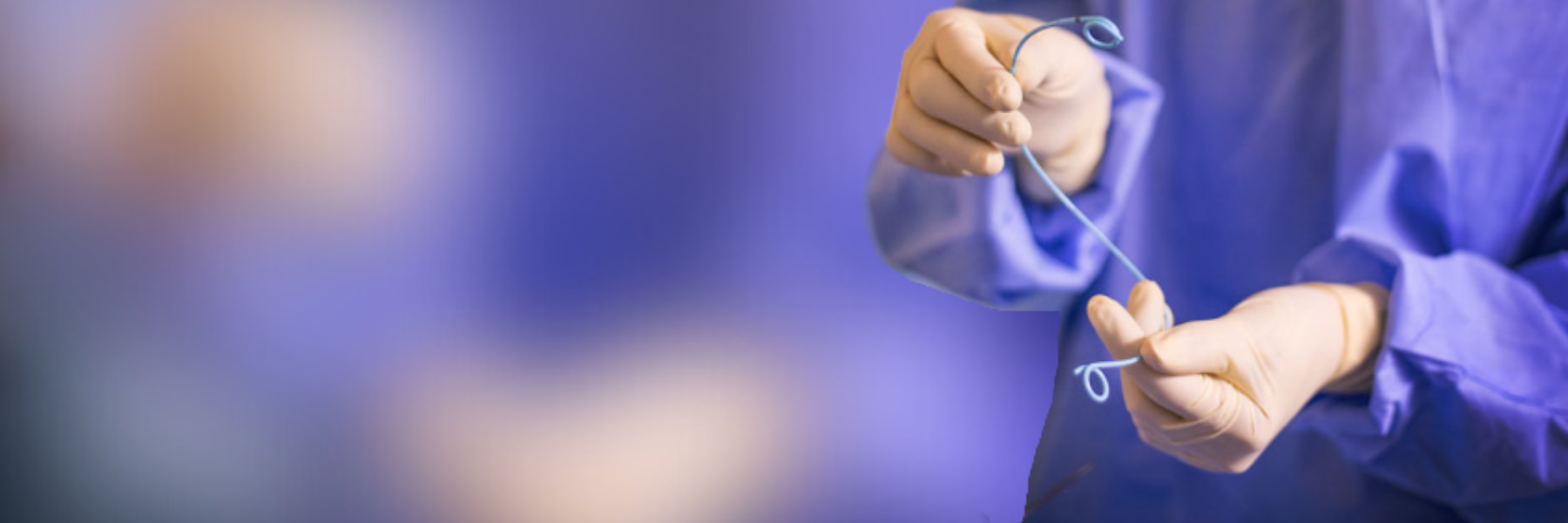 A physician holding a Tria stent