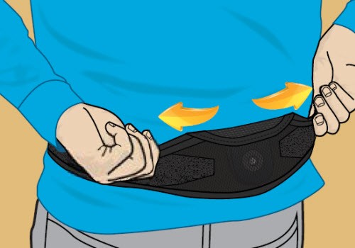 Illustration of person locating the spinal cord stimulator once charger belt is securely fastened